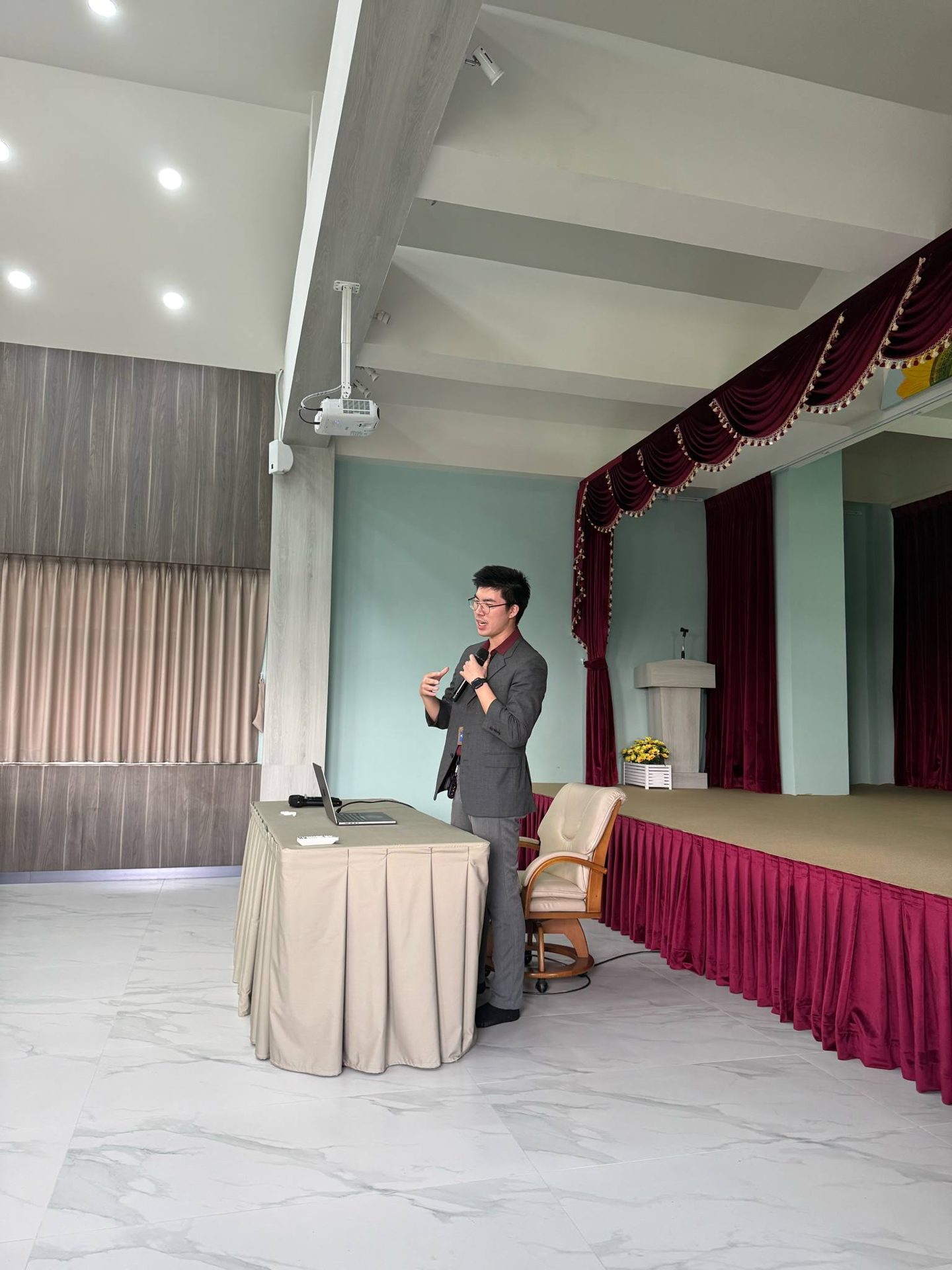 Michael Ananpasin presenting on stage